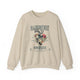 Sweat-shirt beige à col rond avec une illustration de cœur floral et des inscriptions en français.