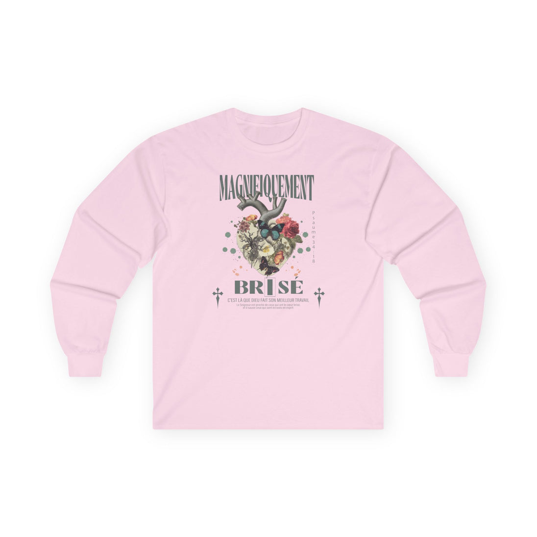 T-shirt rose à manches longues avec un motif floral et religieux centré sur la poitrine.