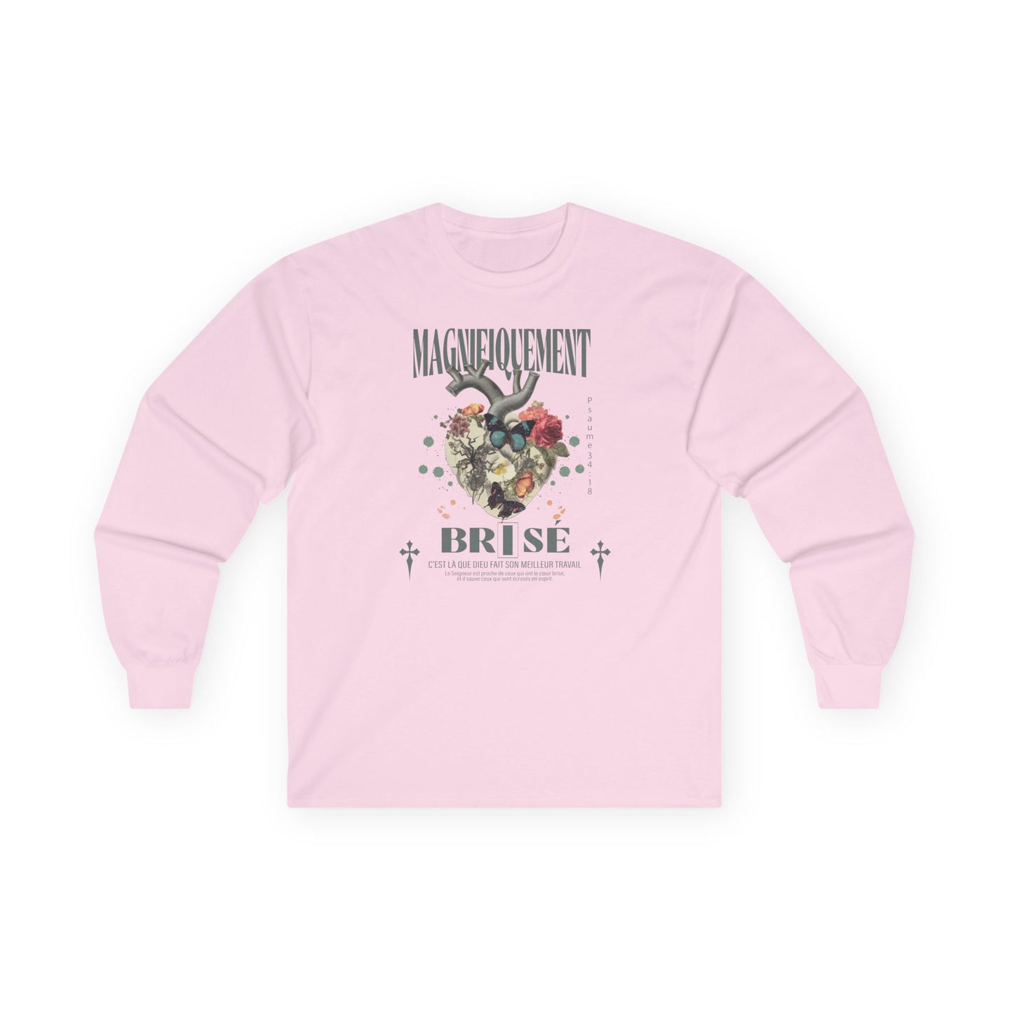 T-shirt rose à manches longues avec un motif floral et religieux centré sur la poitrine.