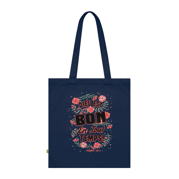Tote bag bleu marine en coton biologique orné d'un motif floral et du texte Dieu est bon.