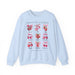 Sweat-shirt bleu clair orné d'illustrations de fruits et de nœuds avec le texte Fruit de l'Esprit.