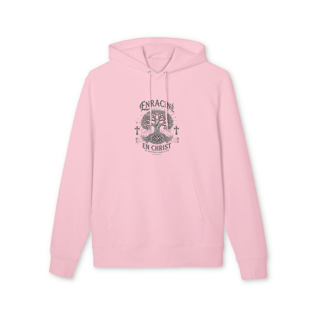 Sweat à capuche rose pâle avec un motif d'arbre et l'inscription Enraciné en Christ.