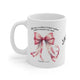 Mug en céramique blanche orné d'un nœud rose et du verset biblique Jacques 1:17.