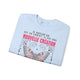 Sweat-shirt bleu clair plié avec un papillon et le texte Si quelqu'un est en Christ.
