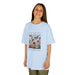 T-shirt bleu clair pour enfant avec une illustration de fleurs et papillons et un texte inspirant.
