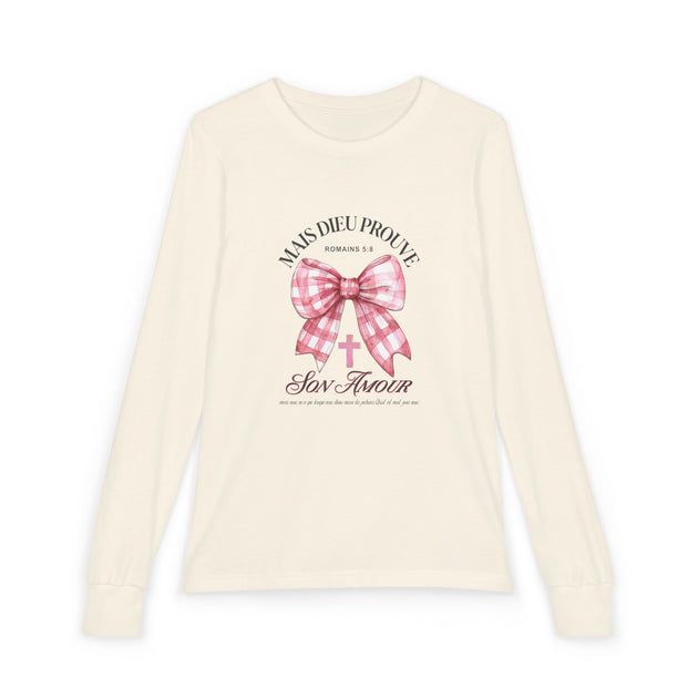 T-shirt à manches longues beige pour enfant avec un motif de nœud rose et une croix chrétienne.