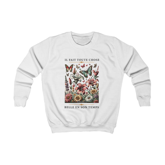 Sweat-shirt blanc pour enfant orné d'un motif floral et de papillons avec un texte inspirant.