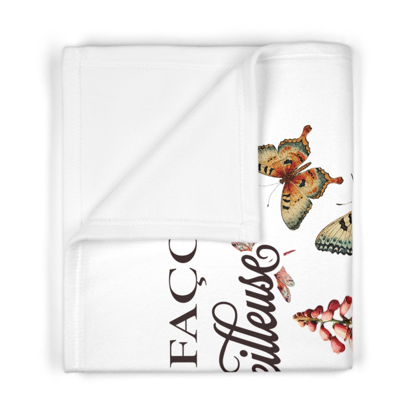 Couverture bébé blanche en polaire ornée de papillons et de fleurs avec une inscription en français.