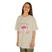 T-shirt beige pour enfant orné d'un ruban rose à l'aquarelle et d'un verset biblique.