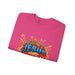 Sweat-shirt rose plié avec une illustration style comics portant l'inscription Jésus est mon héros.