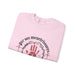 Sweat-shirt rose plié avec une couronne d'épines, une main ensanglantée et le texte Esaïe 53:5.