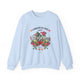 Sweatshirt bleu clair à col rond orné d'un motif floral et de l'inscription L'Amour de Dieu.