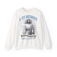 Sweat-shirt blanc à col rond avec une illustration religieuse et le texte Il est ressuscité.