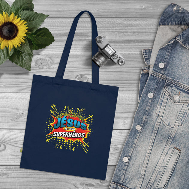 Tote bag bleu marine en coton avec une illustration style comics Jésus est mon superhéros.