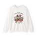 Sweat-shirt blanc à col rond orné d'un motif floral coloré et de l'inscription L'amour de Dieu.