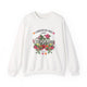 Sweat-shirt blanc à col rond orné d'un motif floral coloré et de l'inscription L'amour de Dieu.