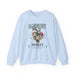Sweat-shirt bleu clair avec un motif de cœur floral et le texte Magnifiquement Brisée.