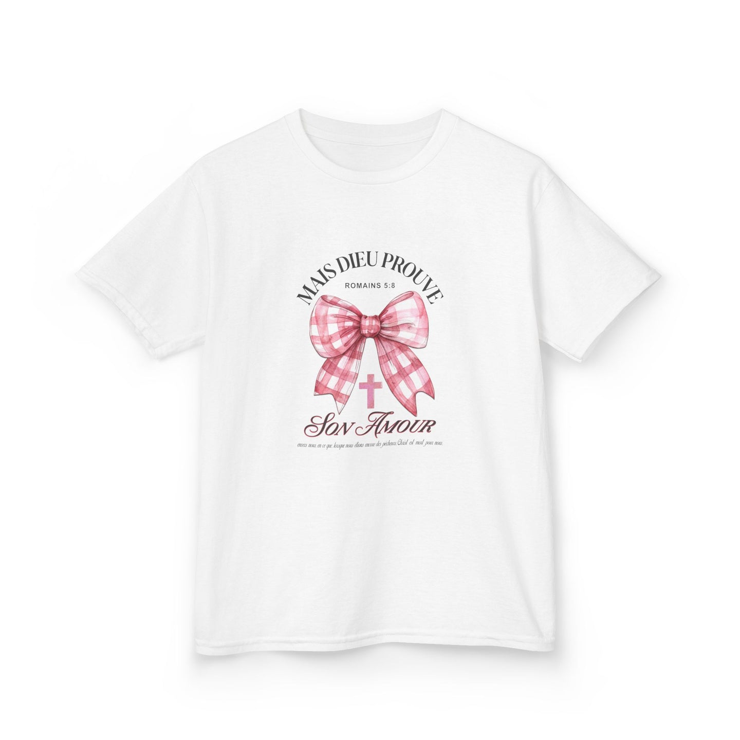 T-shirt blanc pour enfant orné d'un nœud rose à carreaux et d'une croix avec un texte religieux.