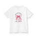 T-shirt blanc pour enfant orné d'un nœud rose à carreaux et d'une croix avec un texte religieux.