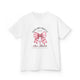 T-shirt blanc pour enfant orné d'un nœud rose à carreaux et d'une croix avec un texte religieux.