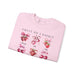 Sweat-shirt rose pâle orné d'illustrations de fraises et de cerises avec des nœuds.