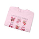 Sweat-shirt rose pâle orné d'illustrations de fraises et de cerises avec des nœuds.