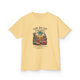 T-shirt jaune pour enfant avec une illustration de désert et un texte biblique en français.