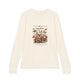 T-shirt à manches longues beige pour enfant avec un imprimé floral et papillons.