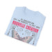 T-shirt bleu clair plié avec un papillon et le texte Si quelqu'un est en Christ, nouvelle création.
