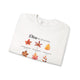 Sweatshirt blanc plié orné de feuilles d'automne et de textes bibliques en français.