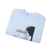 Sweat-shirt bleu clair plié avec une illustration de Jésus et un texte religieux en français.