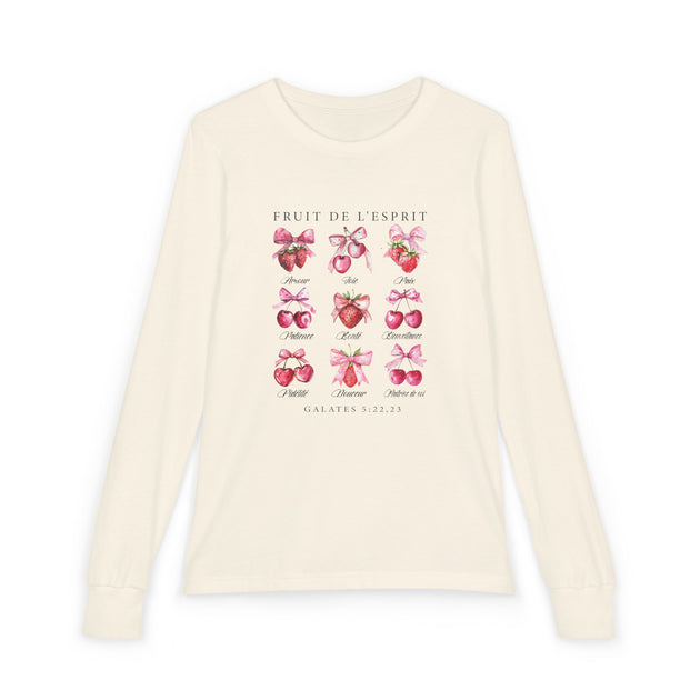 T-shirt à manches longues beige pour enfant avec un imprimé de fruits et de rubans roses.