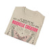 T-shirt beige plié avec un papillon et le texte Si quelqu'un est en Christ, il est une nouvelle création.