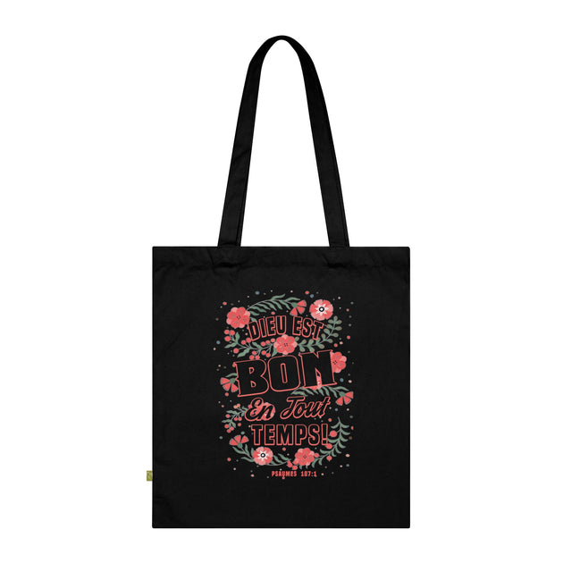 Tote bag noir en coton biologique orné d'un motif floral et du texte Dieu est bon en tout temps.