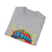 T-shirt gris plié avec un motif style bande dessinée représentant une couronne d'épines et Jésus.