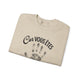 Sweat-shirt beige plié avec l'inscription Car vous êtes et une empreinte de main noire.