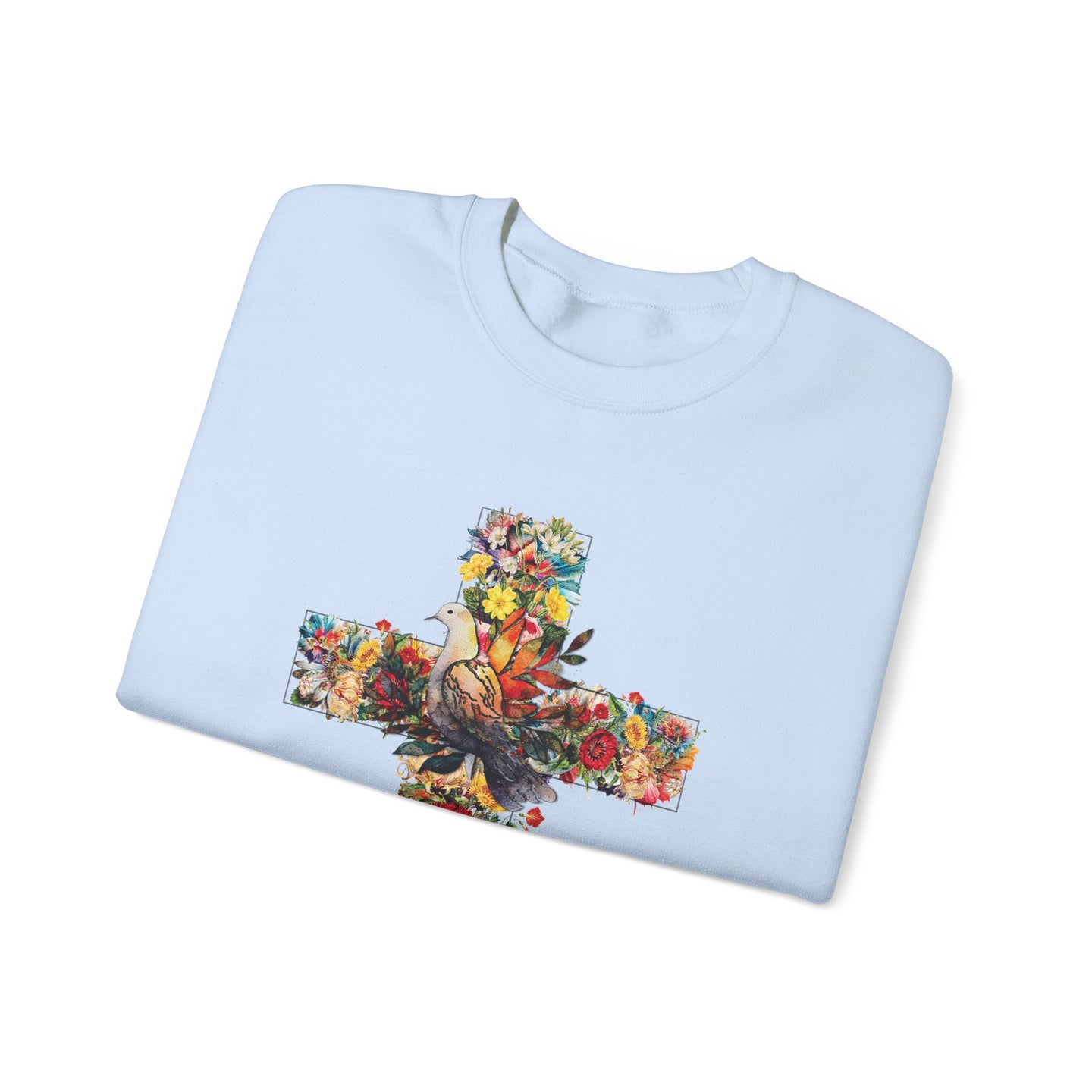 Sweat-shirt bleu clair plié avec une illustration de colombe et de fleurs en forme de croix.