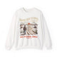 Sweat-shirt blanc à col rond avec une illustration de voyageur et un message religieux en français.