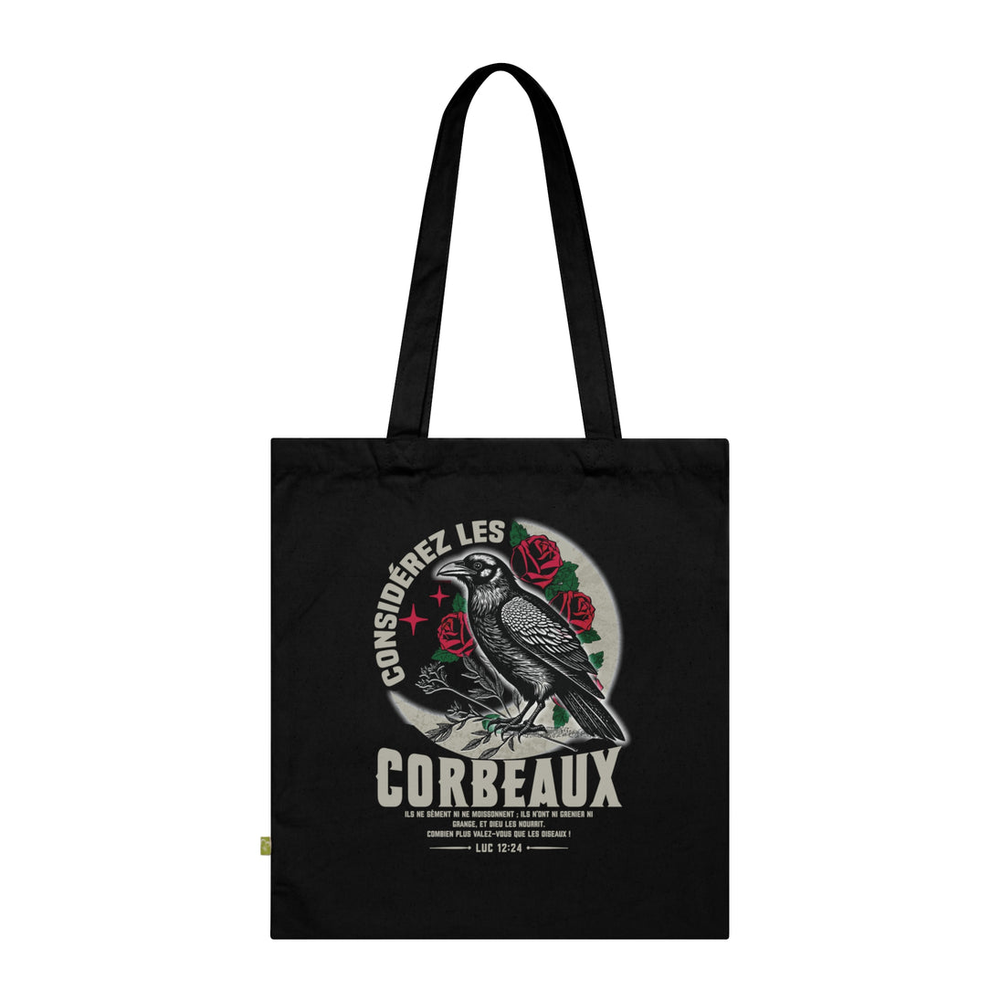 Tote bag noir en coton biologique illustré d'un corbeau entouré de roses avec un verset biblique.