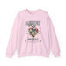 Sweat-shirt rose pâle pour femme avec une illustration de cœur floral et des inscriptions.