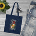 Tote bag bleu marine en coton biologique orné d'un motif floral et de l'inscription Créé Objectif.