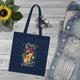 Tote bag bleu marine en coton biologique orné d'un motif floral et de l'inscription Créé Objectif.