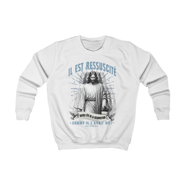 Sweatshirt blanc pour enfant avec une illustration du Christ et le texte Il est ressuscité.