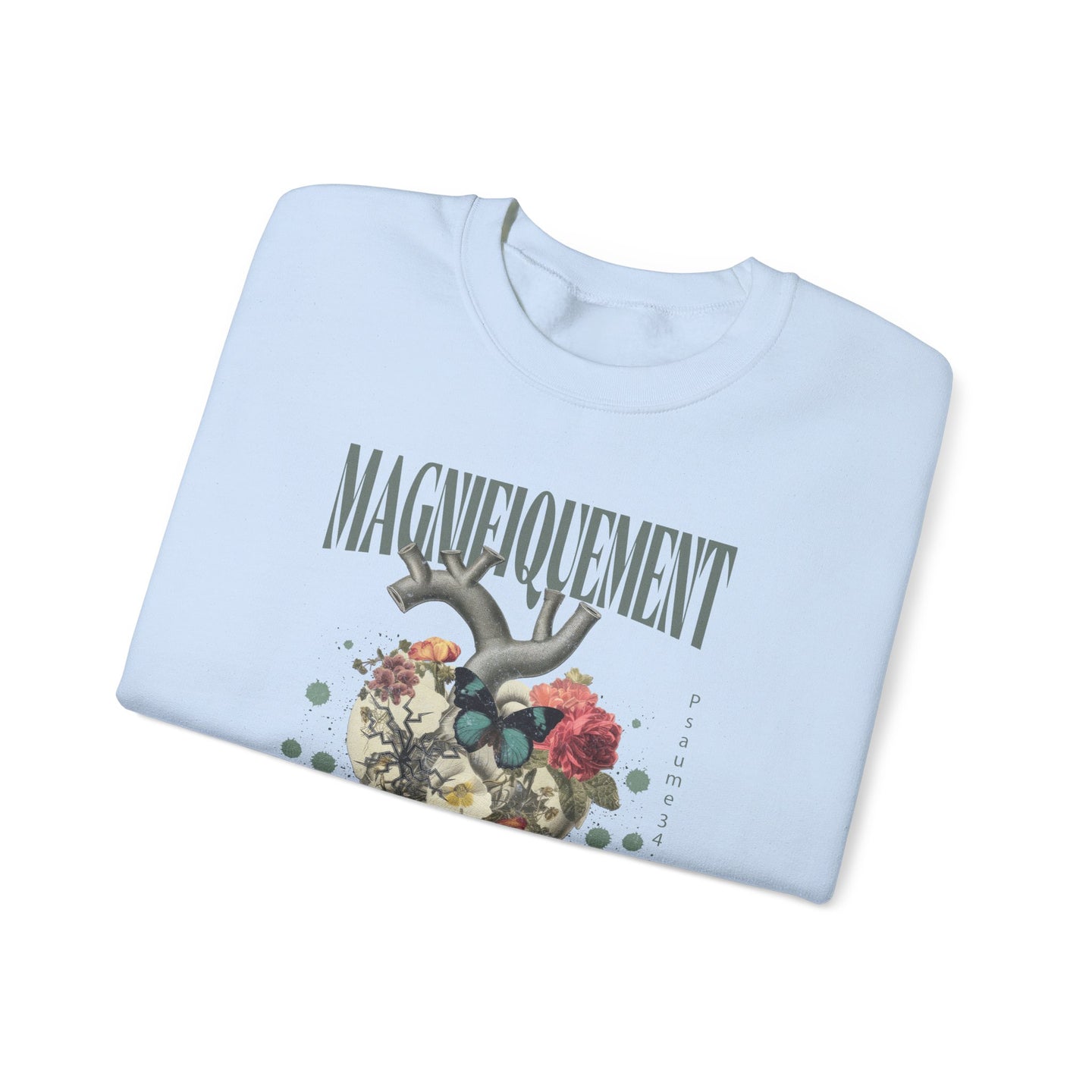 Sweat-shirt bleu clair plié avec une illustration de cœur floral et le texte Magnifiquelement.