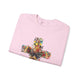 Sweat-shirt rose pour femme orné d'une croix florale avec une colombe en son centre.