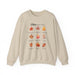 Sweat-shirt beige à col rond orné d'un motif de feuilles d'automne et de textes bibliques.