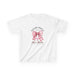 T-shirt blanc pour enfant orné d'un nœud rose à carreaux, d'une croix et du texte religieux.
