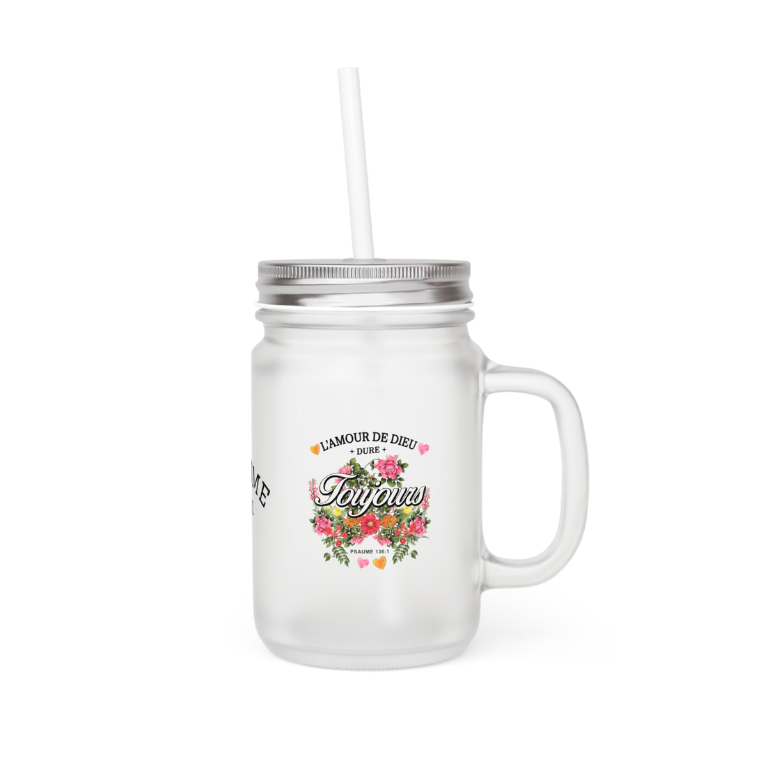 Un bocal en verre dépoli avec couvercle, paille et un motif floral portant l'inscription religieuse.