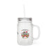 Un bocal en verre dépoli avec couvercle, paille et un motif floral portant l'inscription religieuse.