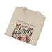 T-shirt beige plié avec un motif floral et de papillons accompagné du texte Il fait toute chose.